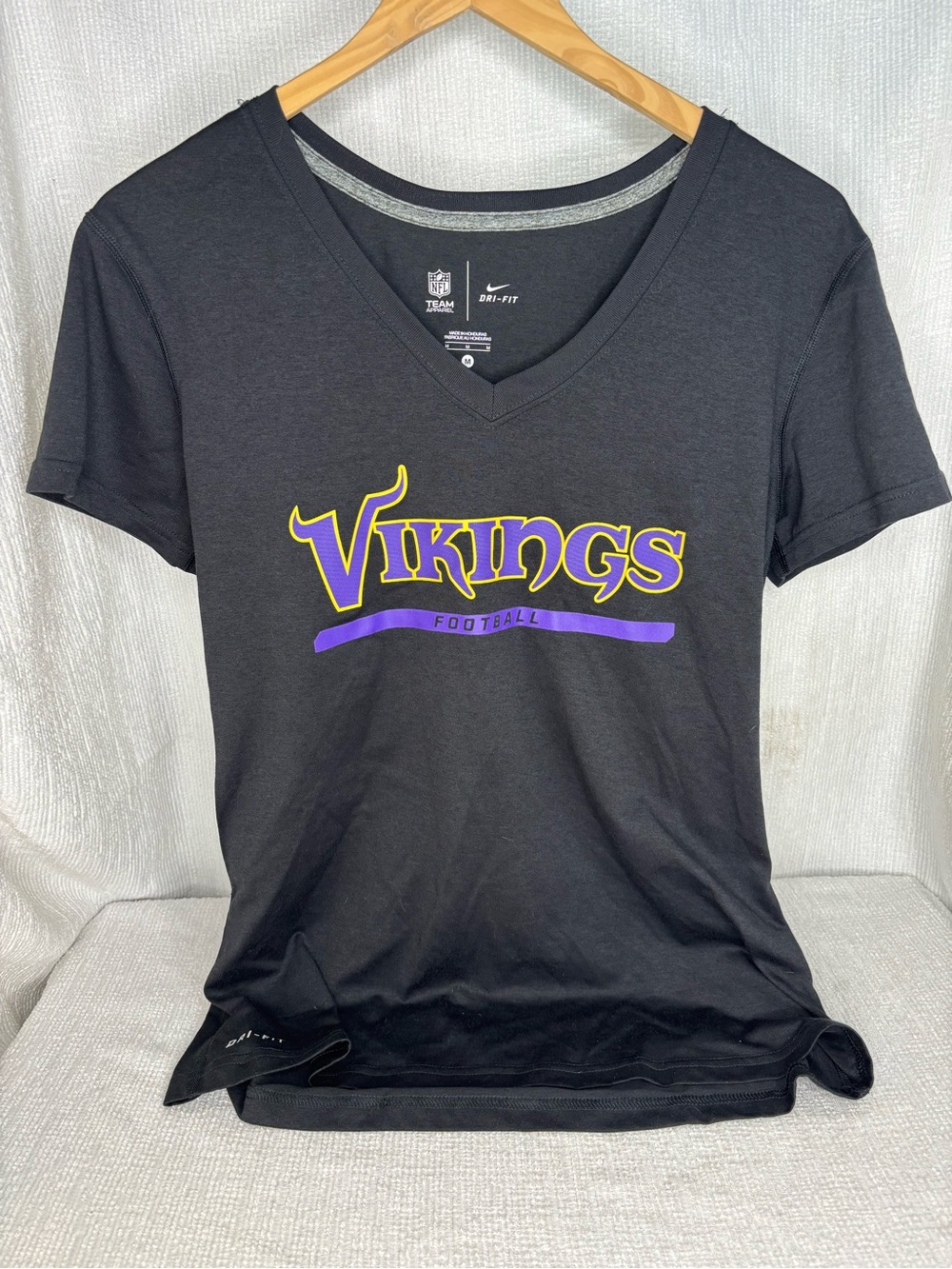 NFL Black V-Neck Vikings Football Tee with Purple and Gold Logo